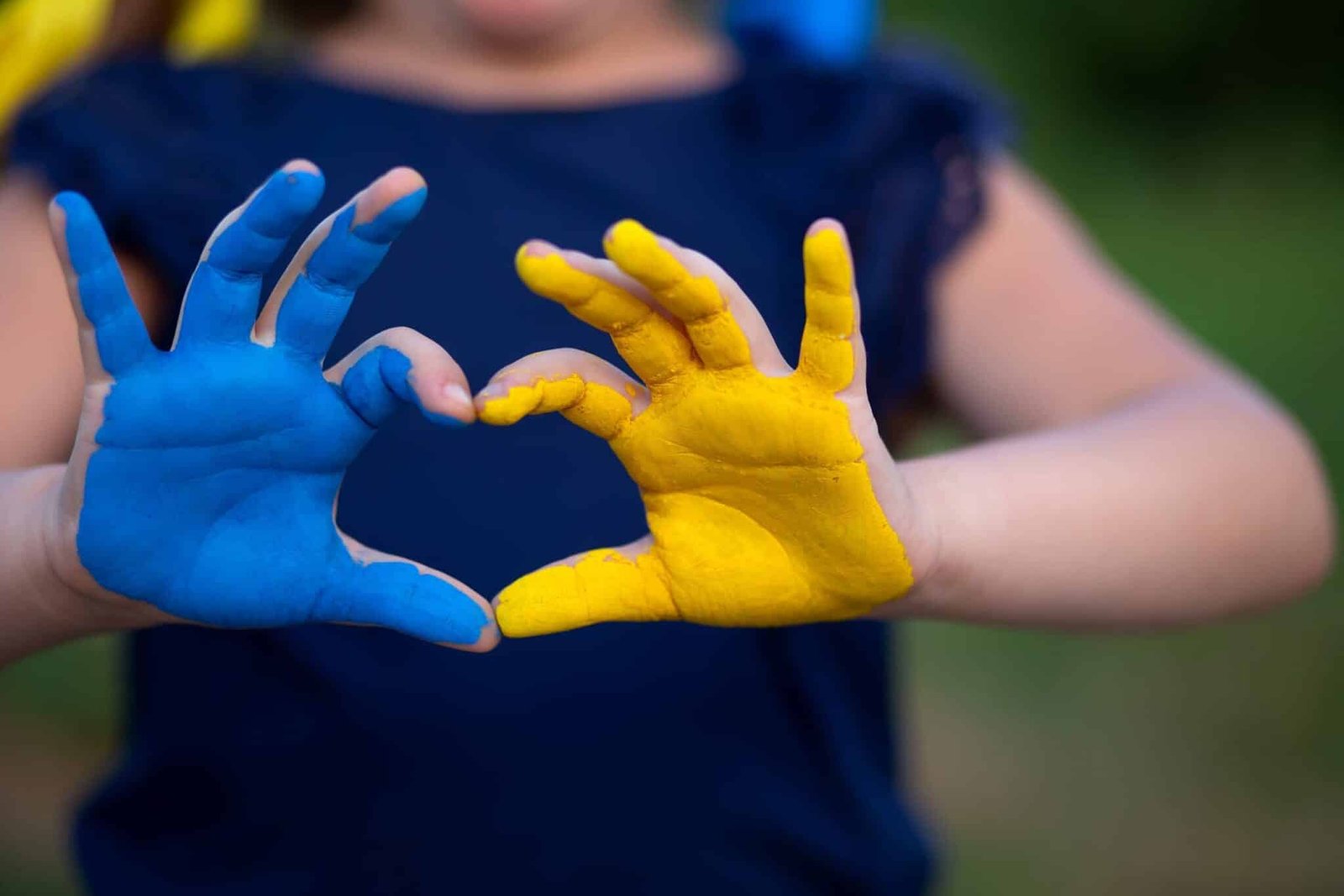 Love,Ukraine,Concept.,Hands,In,Heart,Form,Painted,In,Ukraine