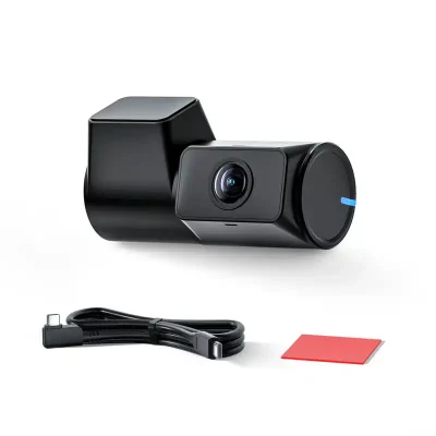 A sleek black dash camera with a blue accent on lens, accompanied by a USB cable and a memory card on a white background.